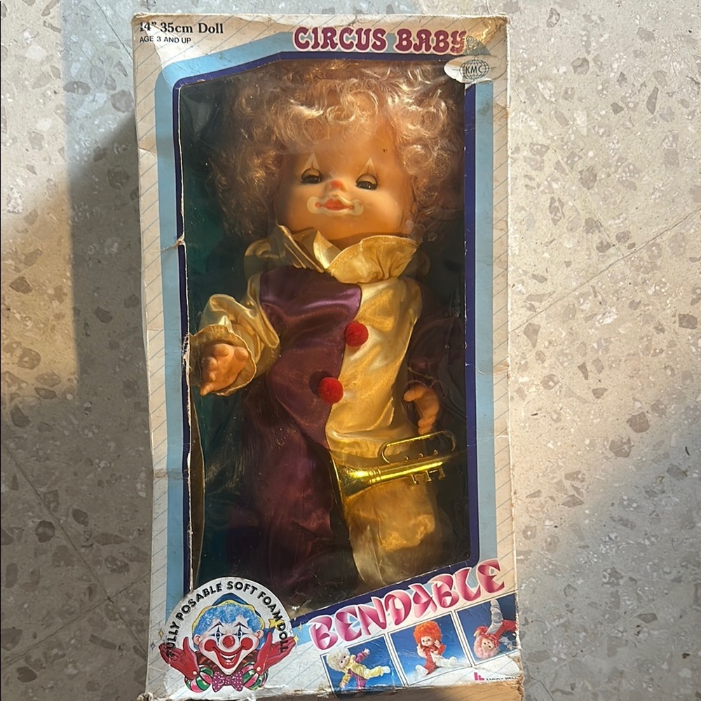 Circus Baby Bendable Doll - Purple and Yellow